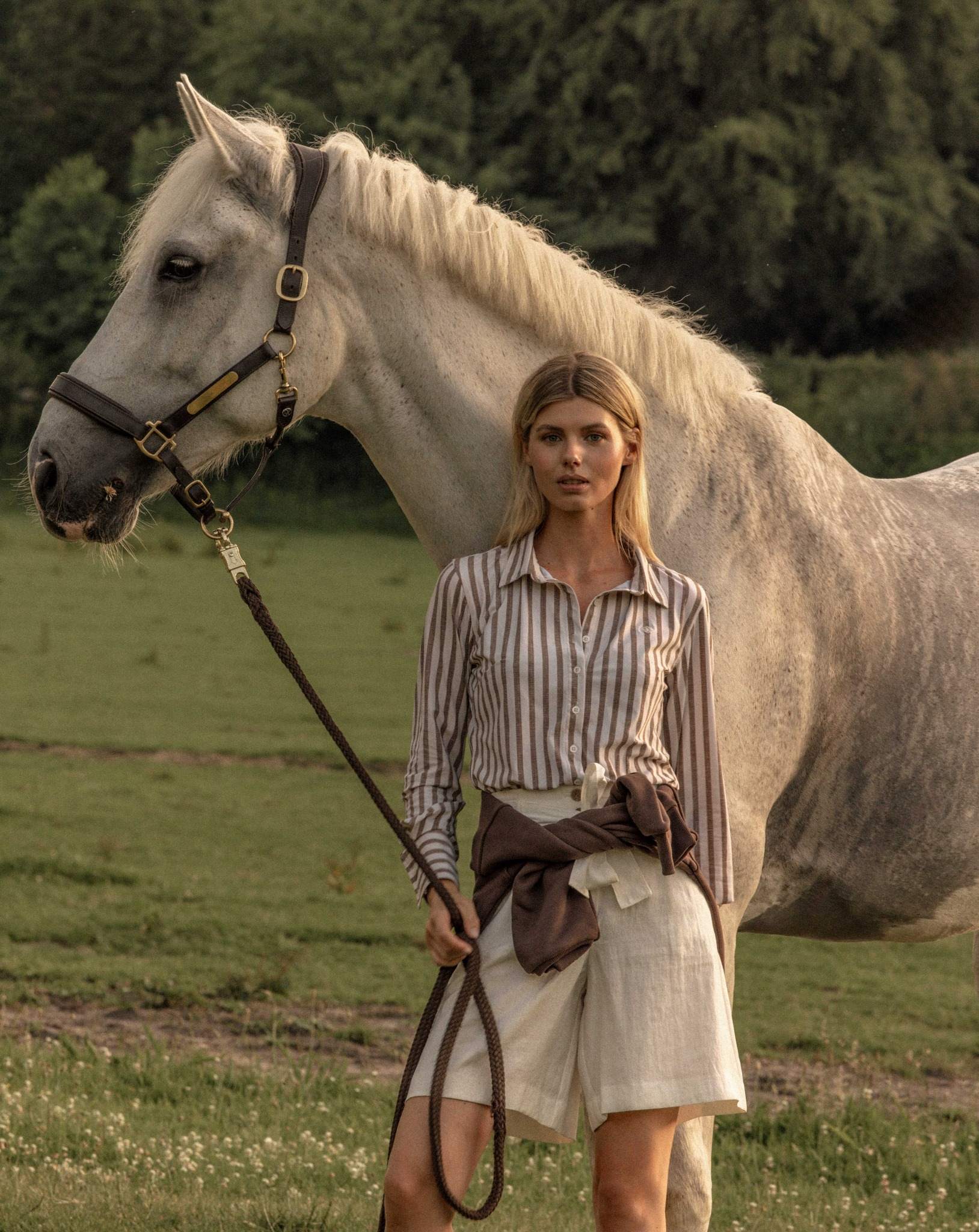 Nomée striped blouse, styled beside a white horse